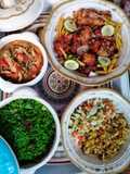 Fried rice, potato salad, shredded chicken and KFC chicken