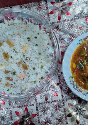 A picture of Chicken Chilli with Mexican Fried Rice.