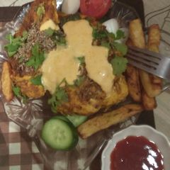 A picture of Grilled chicken with fries and mustard sauce.