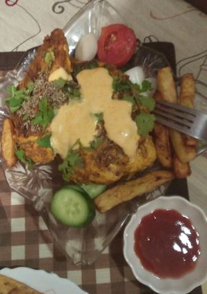 A picture of Grilled chicken with fries and mustard sauce.