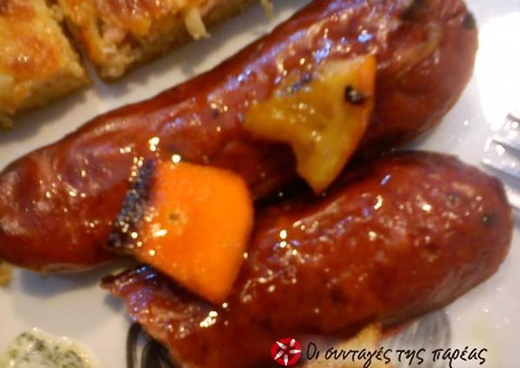 Country sausages with citrus fruits