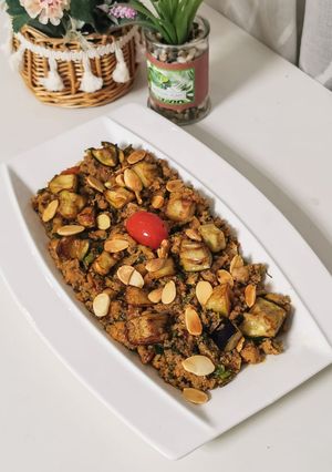 A picture of Couscous with Eggplant and Almonds.