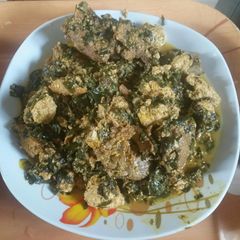 Egusi soup with moringa leaves A picture of Egusi soup with moringa leaves.