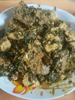 A picture of Egusi soup with moringa leaves.