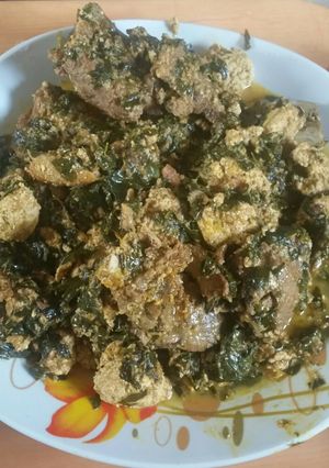 A picture of Egusi soup with moringa leaves.
