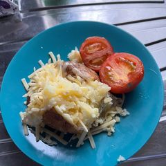 A picture of Microwave Jacket Potato with Mild Cheddar and Air-Fried Tomato.