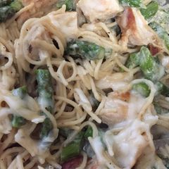 A picture of Chicken, asparagus with angel hair pasta.