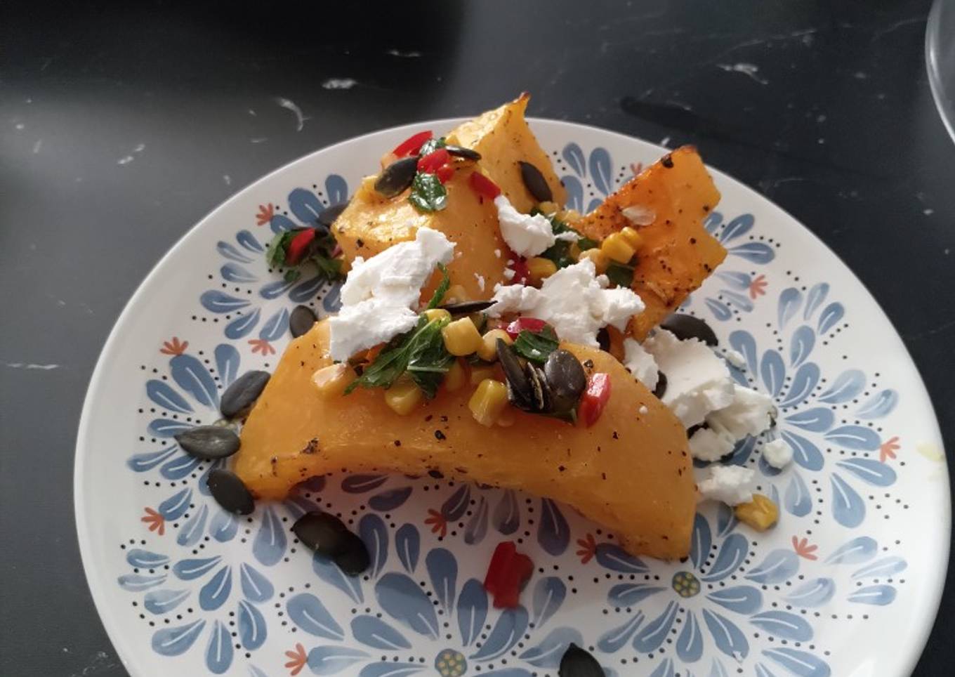 Butternut squash with sweetcorn salsa, feta and pumpkin seeds
