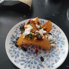 Butternut squash with sweetcorn salsa, feta and pumpkin seeds A picture of Butternut squash with sweetcorn salsa, feta and pumpkin seeds.
