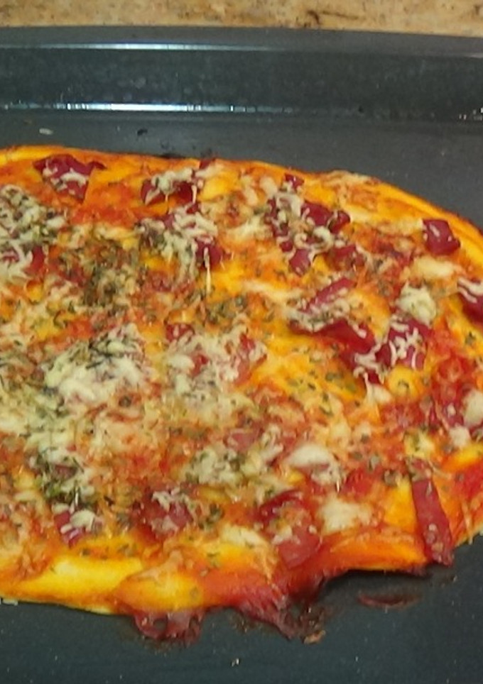 Una foto de Pizza de jamón y queso