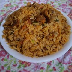 A picture of Palm oil jallop rice and beans.