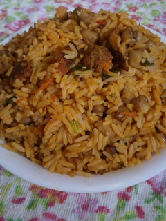 A picture of Palm oil jallop rice and beans.