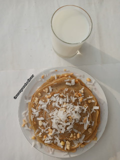 A picture of Coconut pancakes with coconut syrup.