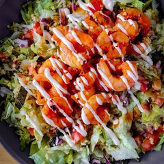 A picture of Spicy Harissa King Prawn Chop Salad.