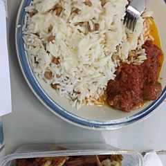 A picture of Rice and beans with tomatoes sauce.
