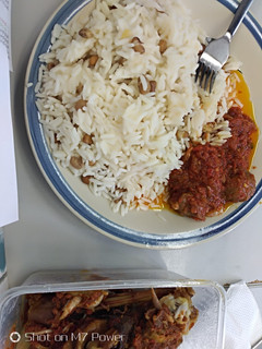 A picture of Rice and beans with tomatoes sauce.