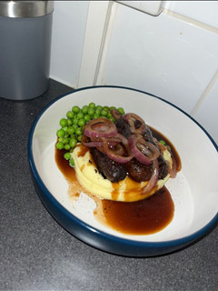 A picture of Sausage and mash.