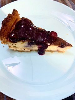 Una foto de Tarta de queso y arándanos