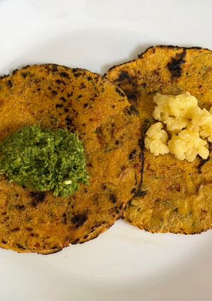 A picture of Soft Makai Rotla Loaded With Veggies (Serve With Green Garlic Chutney & jaggery).