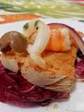 Bruschette con Mazzancolle, Calamari e Olive Verde