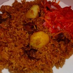 A picture of Beef pilau with kachumbari.