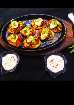 A picture of Schezwan Potato Pizza Bites.
