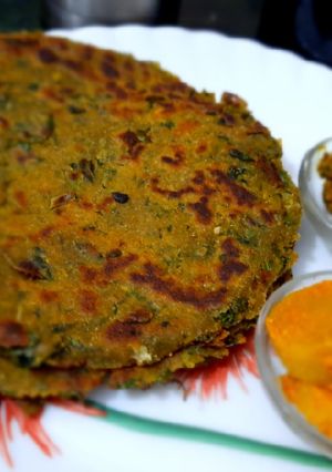 A picture of Mixed millet partha with bathua and methi leaves.