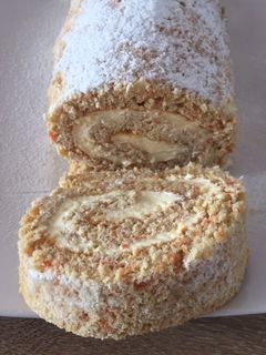 Una foto de Brazo Gitano de zanahoria relleno de queso crema