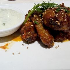 A picture of Chicken Wings with Tartar sauce.