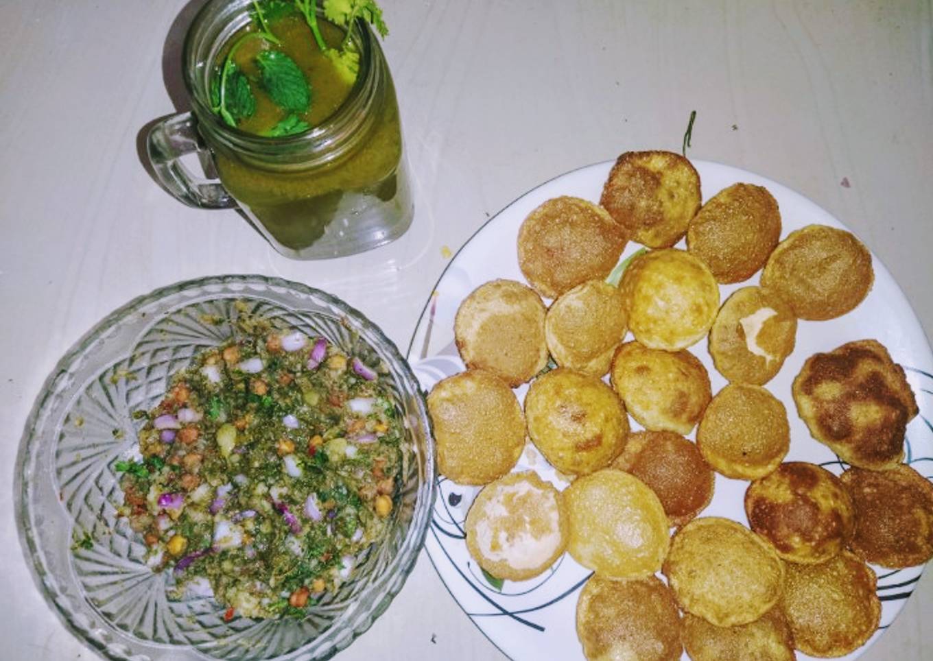 Golgappa with spicy potato-chana masala and spicy flavored water