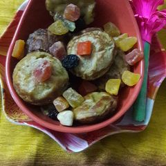 Wheat flour mango muffins in Appe pan A picture of Wheat flour mango muffins in Appe pan.