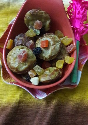 A picture of Wheat flour mango muffins in Appe pan.
