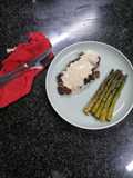 Sirloin steak and goat cheese sauce served with asparagus