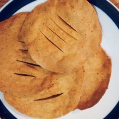 A picture of Baked Masala Poori (Spicy Indian bread).