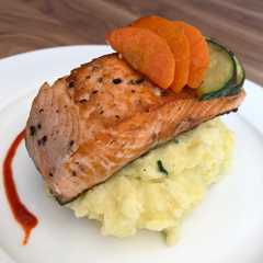 A picture of Grill salmon + mash potato + stir fry wortel zucchini.