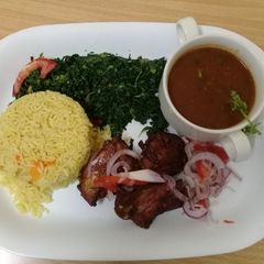 A picture of Steamed Tumeric Rice,pan grilled chicken, Fried spinach and Mixed Vegetable gravy.