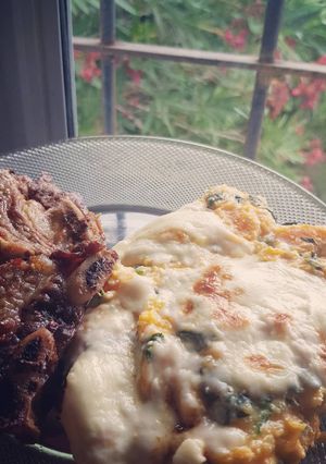 Una foto de Zapallo gratinado relleno de ricotta y espinaca