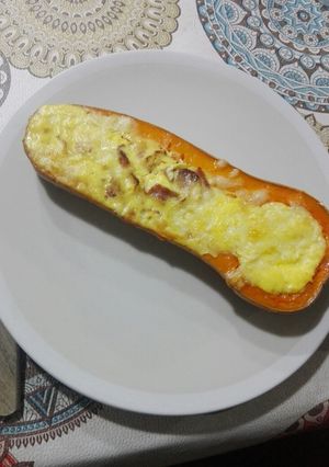 Una foto de Zapallo relleno con queso crema y panceta