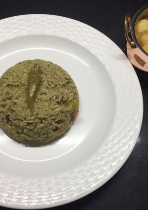 A picture of Masala rice with aloo gravy.
