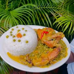 A picture of Coconut Chicken Curry with Peas and Rice.