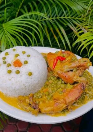 A picture of Coconut Chicken Curry with Peas and Rice.