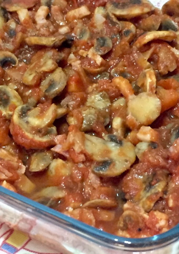 Una foto de Champiñones con tomate