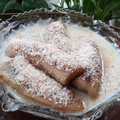 A picture of Fried Banana & Toasted Coconut-Topped Porridge.