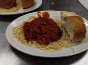 A picture of spaghetti with tomato paste