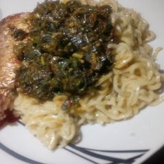 A picture of Noodles with vegetable soup.