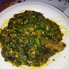 A picture of Okro soup with turkey and sea foods.
