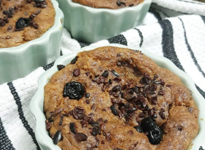 A picture of Easy Banana bread with cocoa nibs and blueberries.