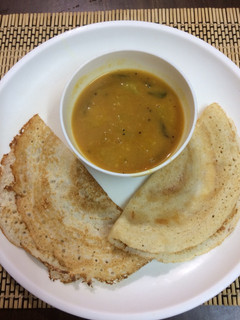 A picture of Urad dal Lapsi dosa with toor dal pumpkin sambar.