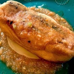 A picture of Chile’s Relleno’s and Ranchero Sauce.