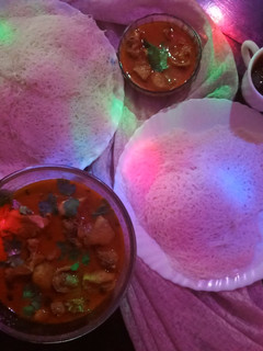 A picture of String hoppers with chicken curry.